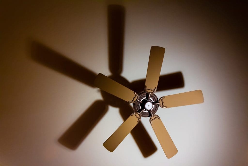 brown ceiling fan with shadow