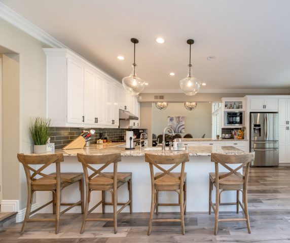 residential lighting in kitchen with overhead dropdown lighting & recessed lighting for Metro Detroit homes